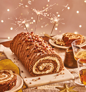 Sticky toffee roulade with toffee sauce and sparklers